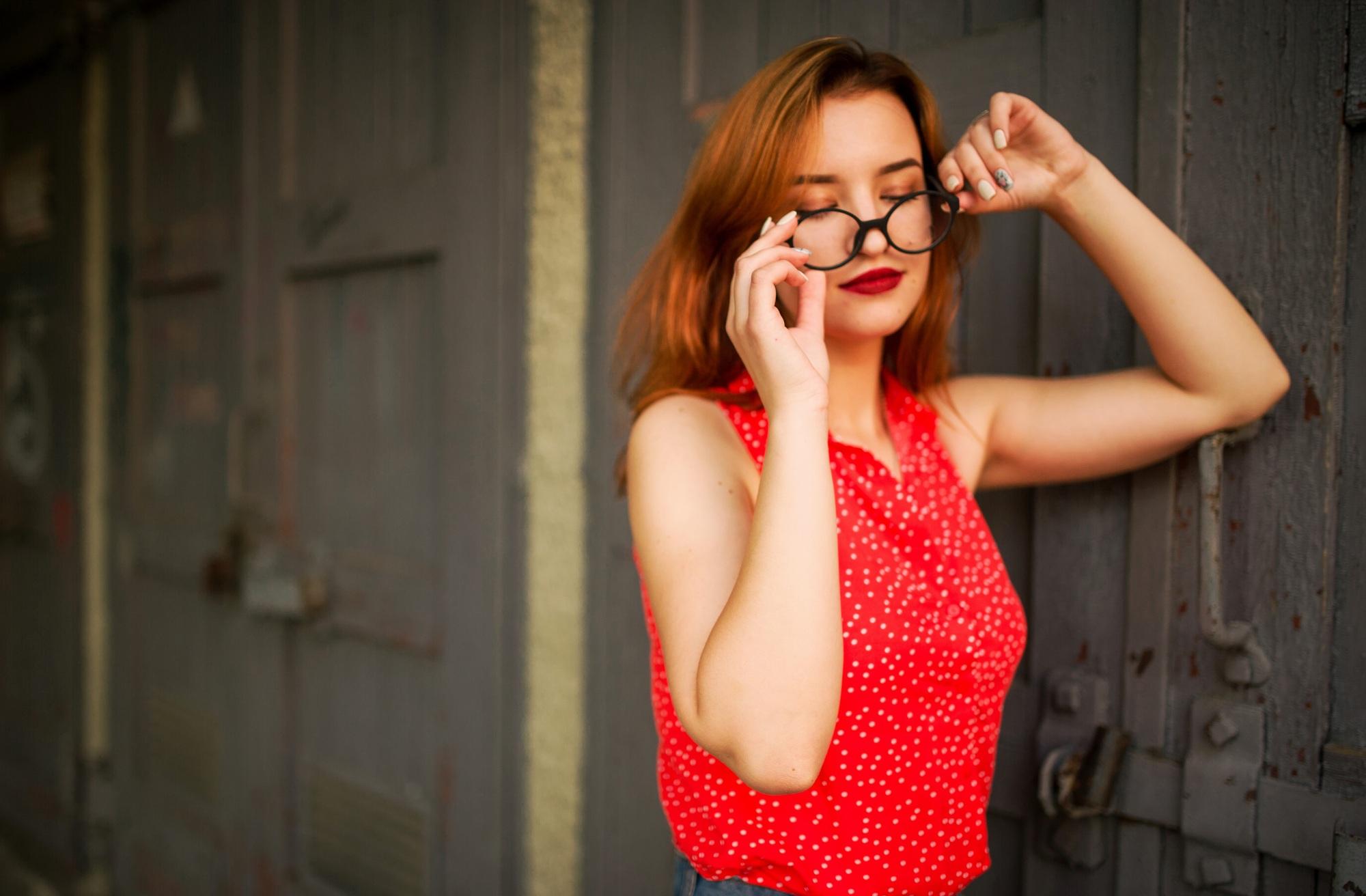 Attractive redhaired woman in eyeglasses