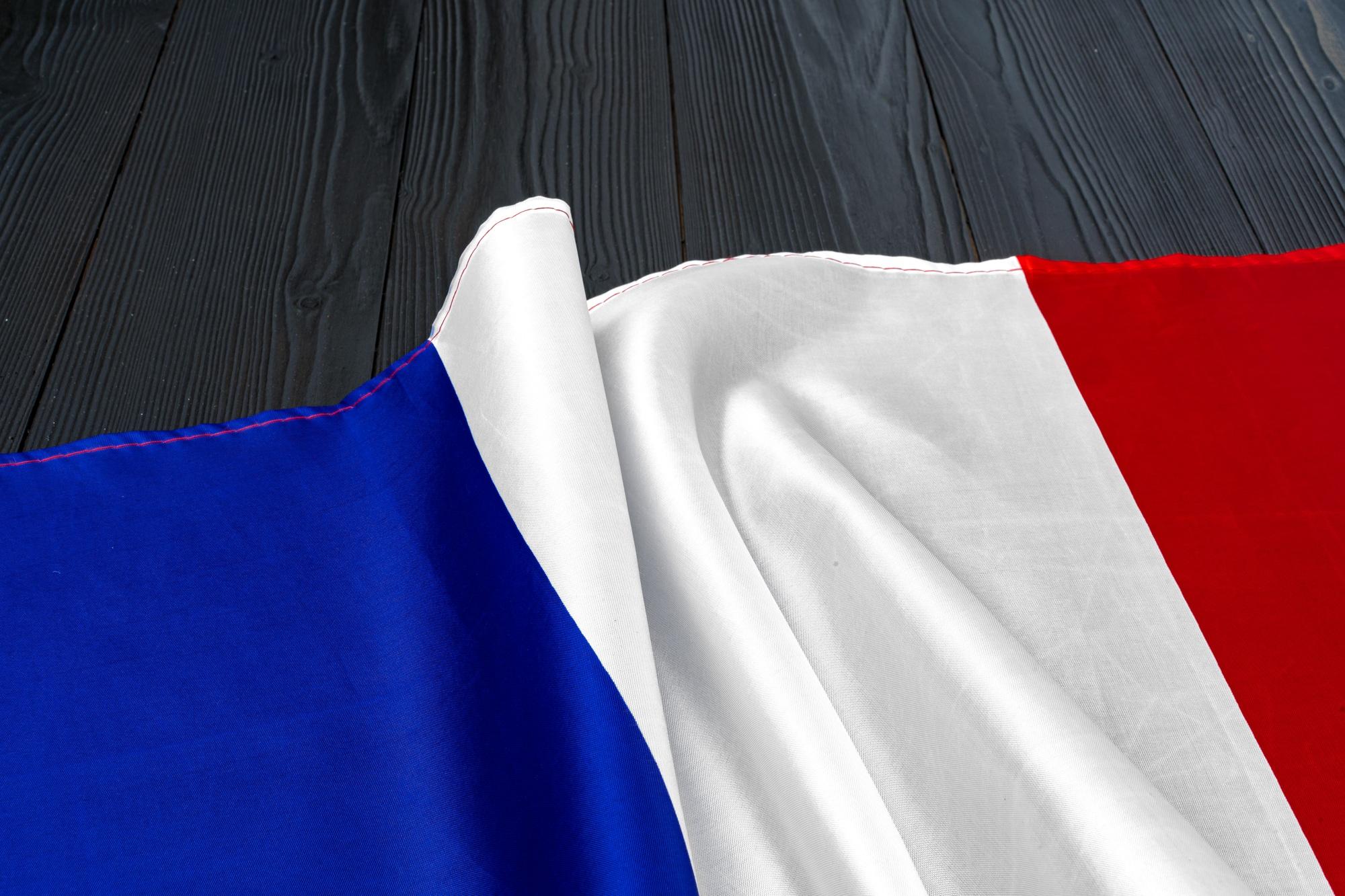 Flag of France on wooden bakground, copy space